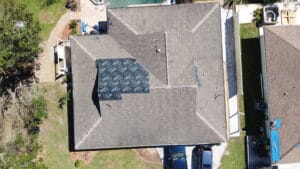 shingle roof damage from hurricane winds.