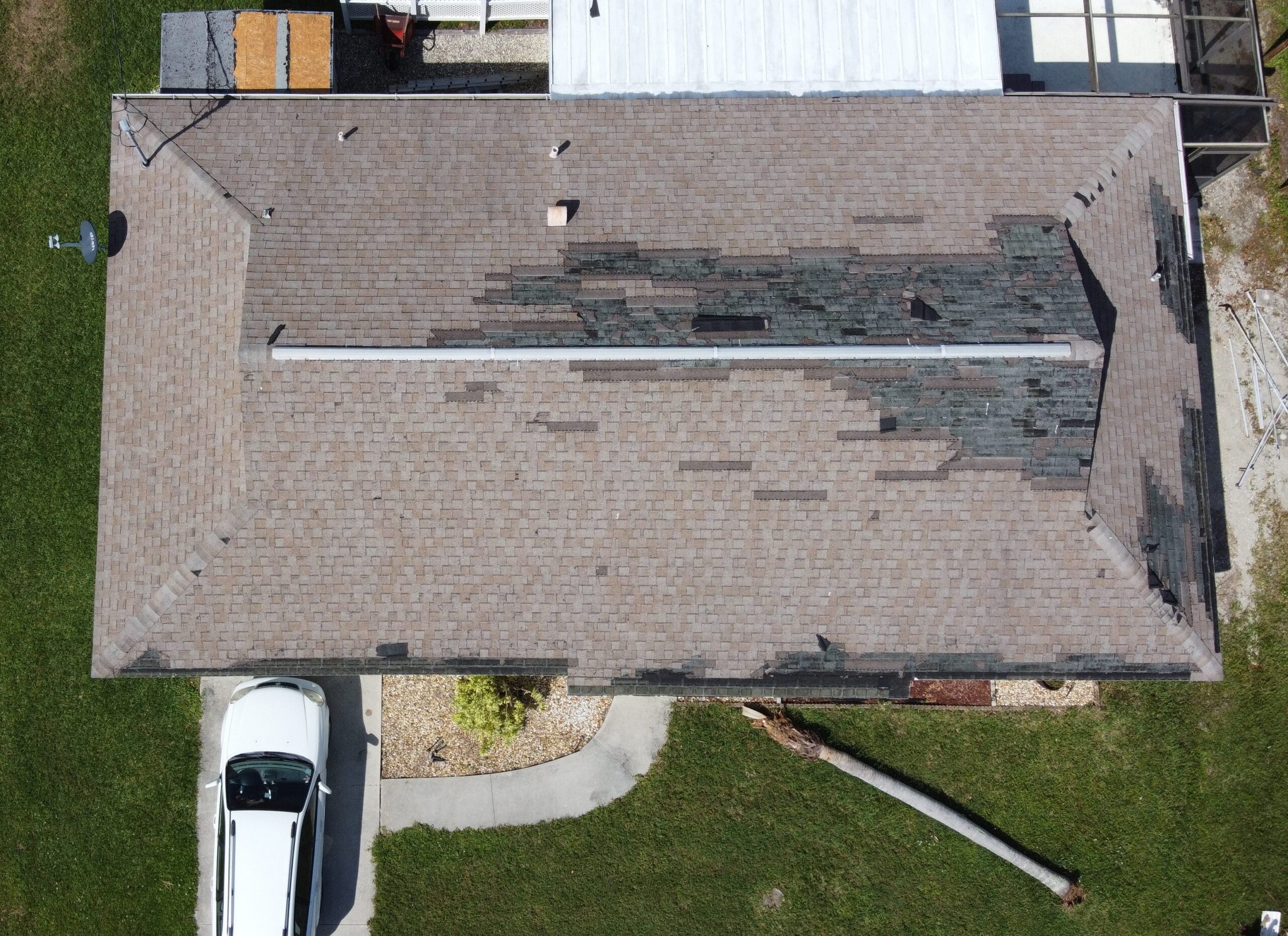 Hurricane damage to homeowners roof.